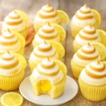 Inside view of lemon meringue cupcake with filling