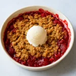 Fresh gluten free strawberry rhubarb crisp in baking dish