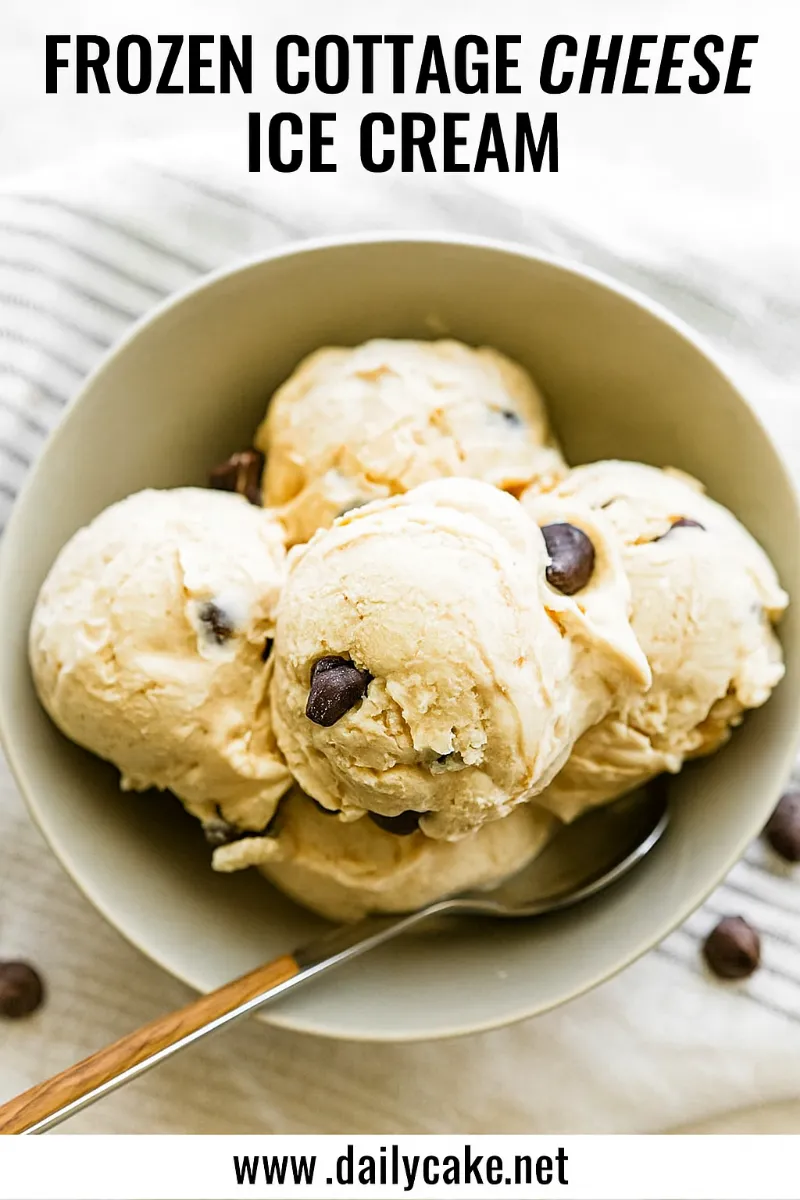 Frozen-Cottage-Cheese-Ice-Cream Bowl of frozen cottage cheese ice cream scoops with chocolate chunks and a spoon.
