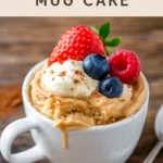 finished peanut butter mug cake topped with whipped cream